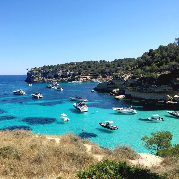 Boats anchored in the turquoise cove of Portals Vells
