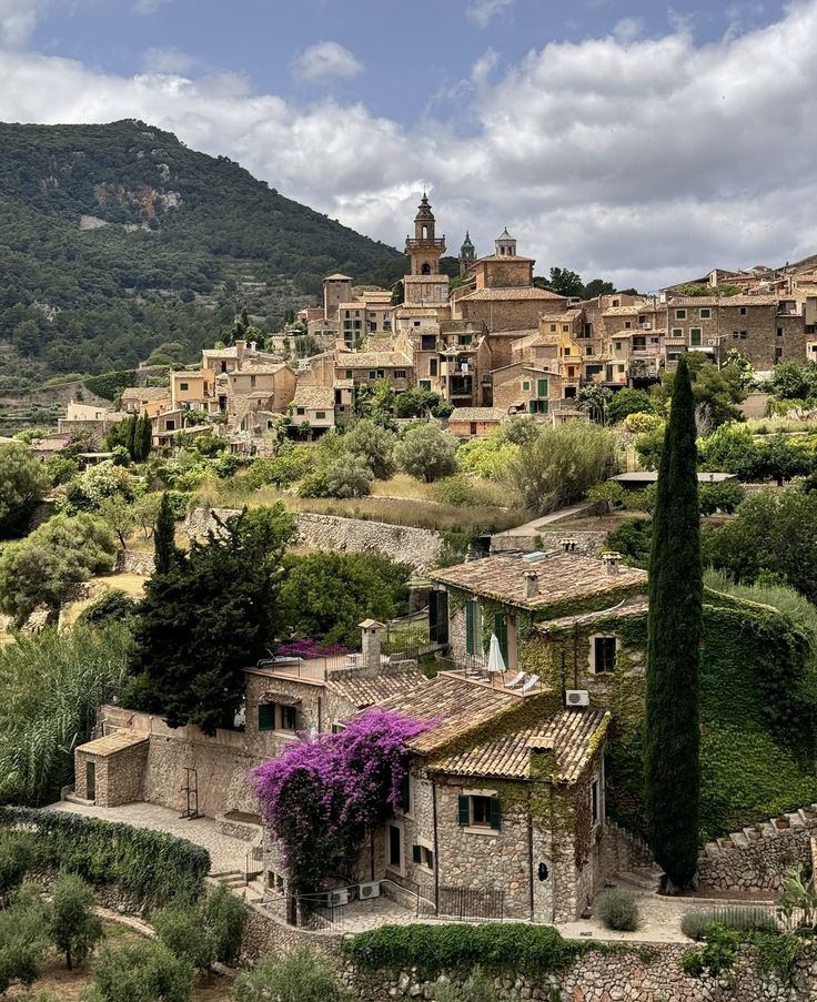 Stone houses and church tower of Valldemossa on the hillside