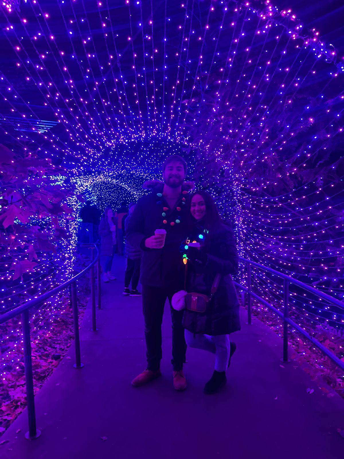 The couple in a tunnel of purple lights