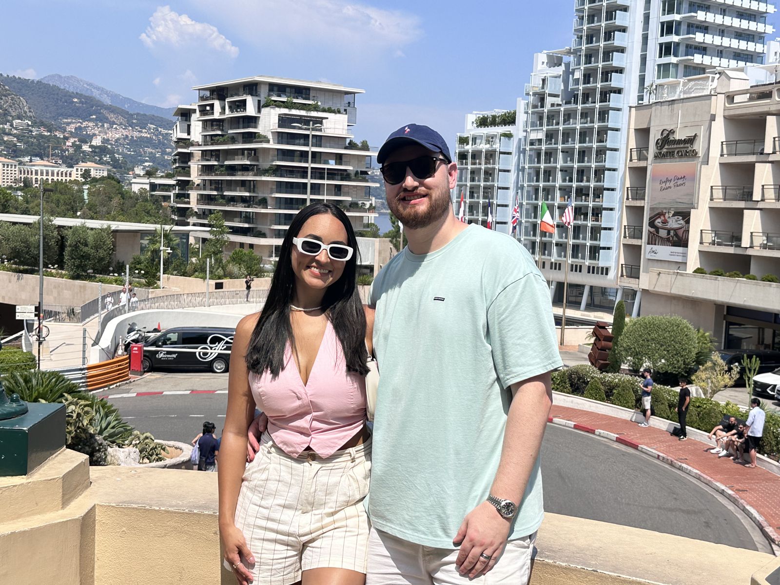 The couple on a terrace above a racetrack bend