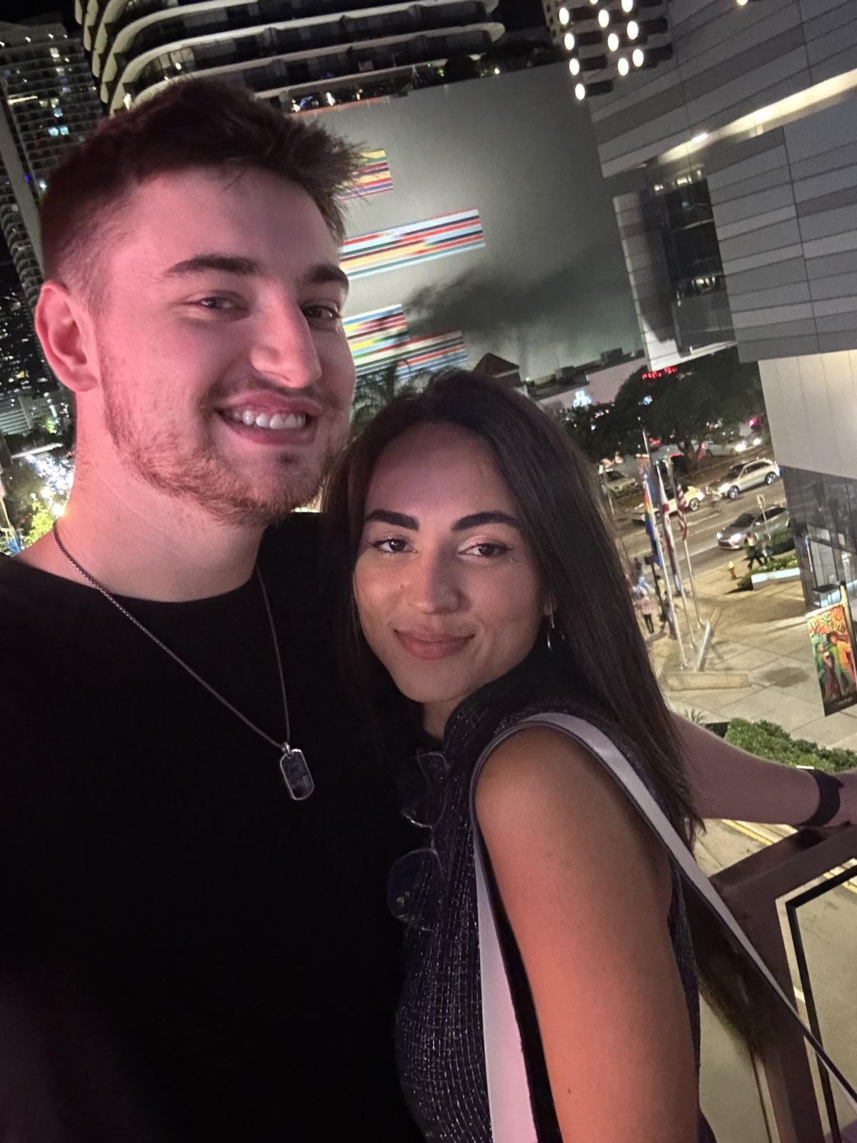 A close-up selfie of the couple at night