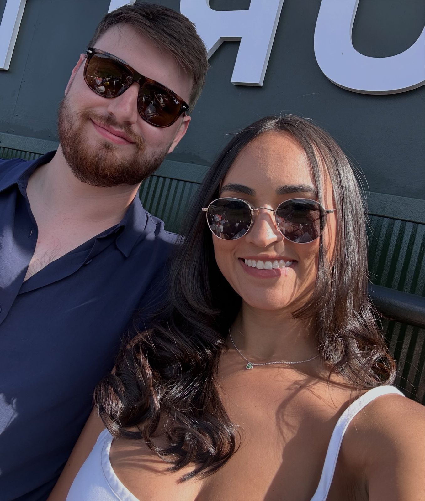 A sunny selfie of the couple wearing sunglasses